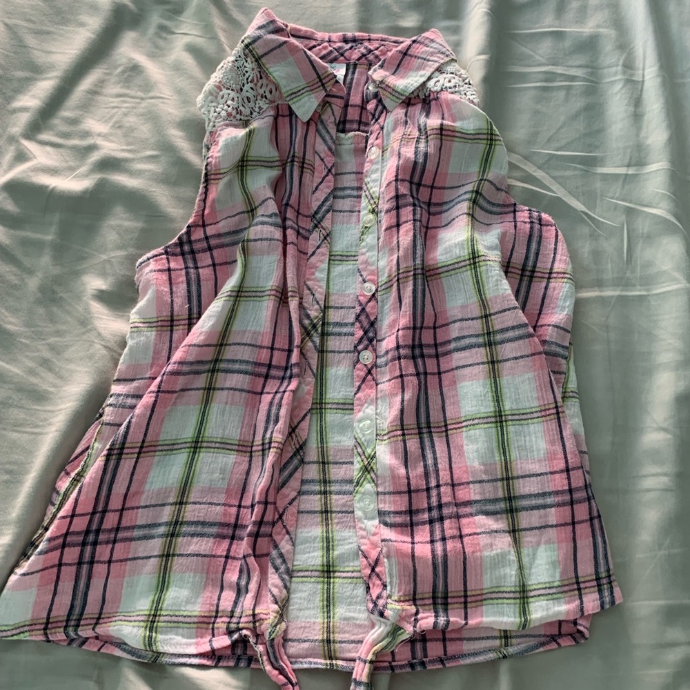 a plaid muscle tee with a floral design on back